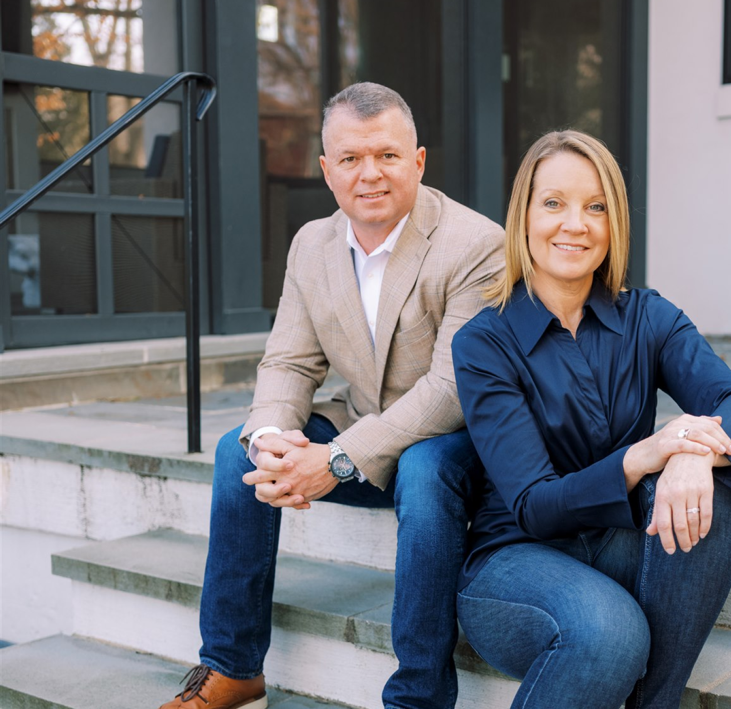 Man and woman sitting on steps