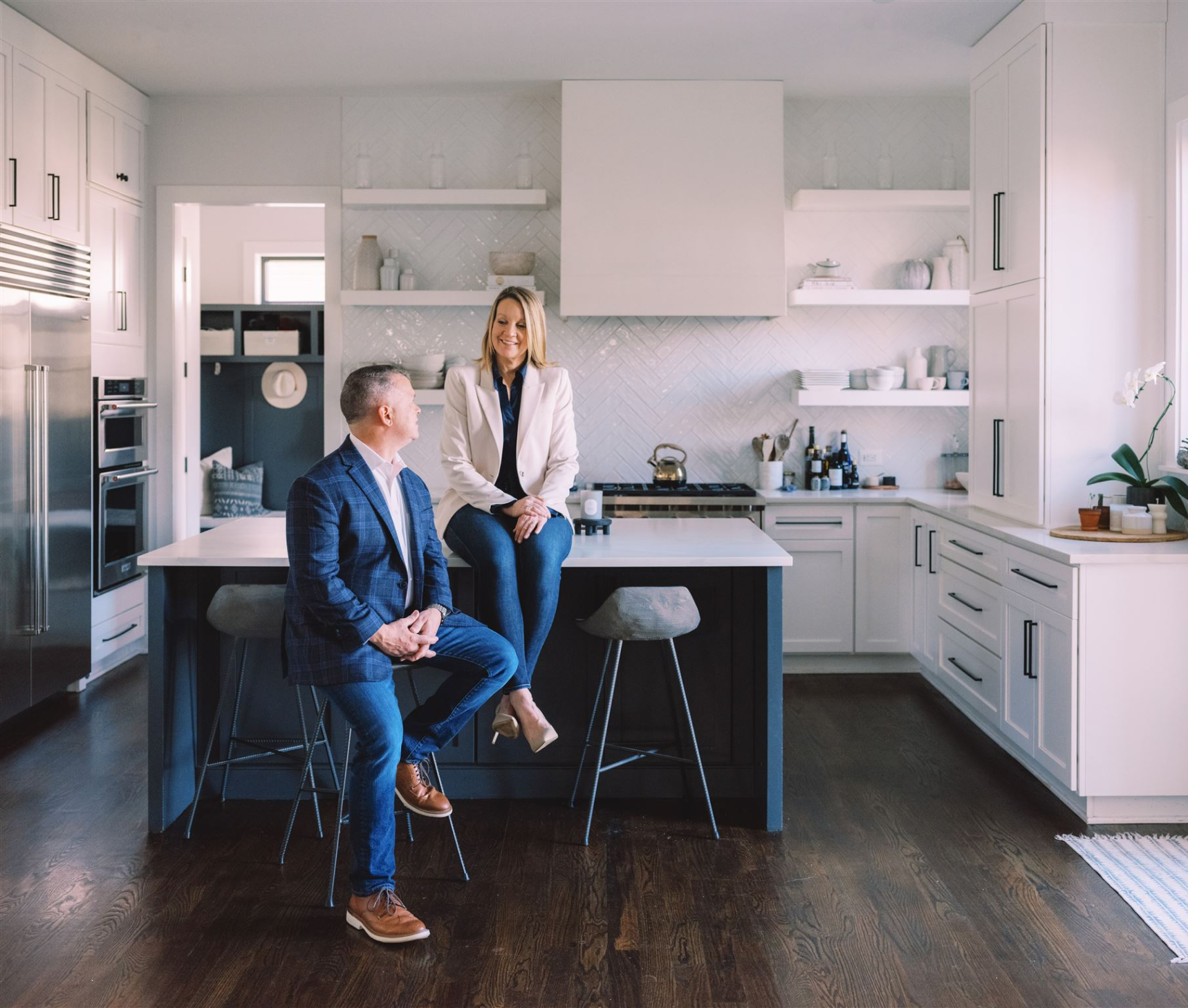 Couple in modern white kitchen